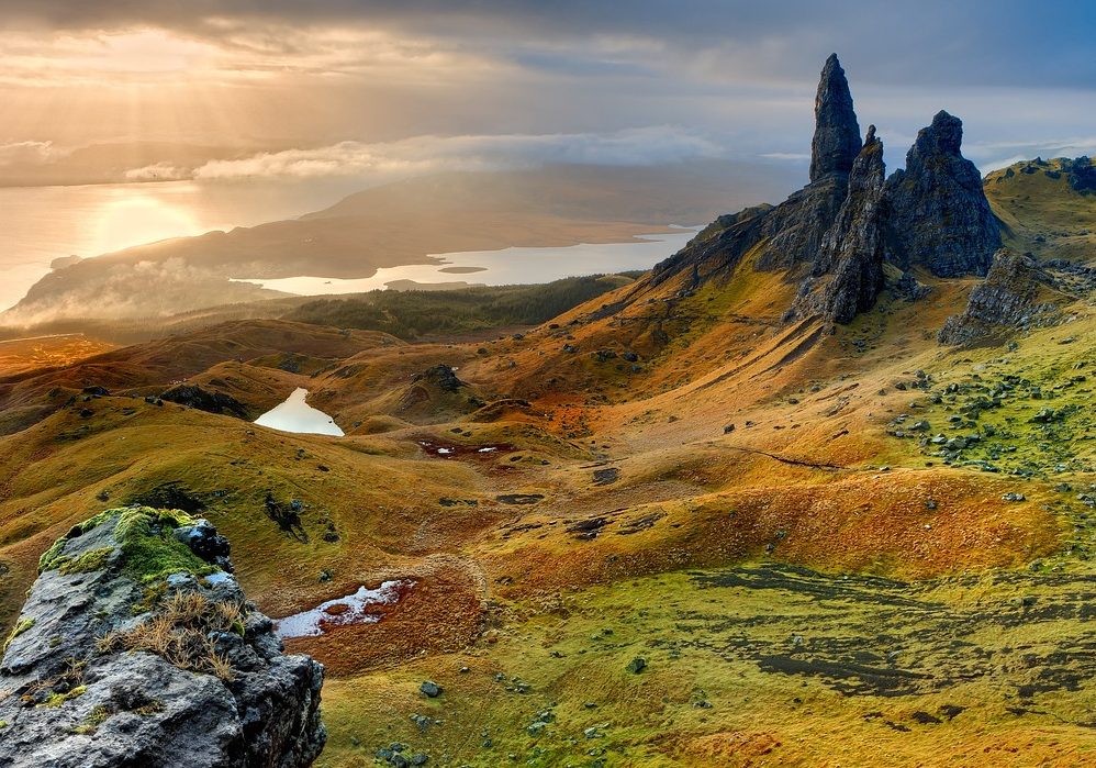 cliffs in scotland with sun setting in background