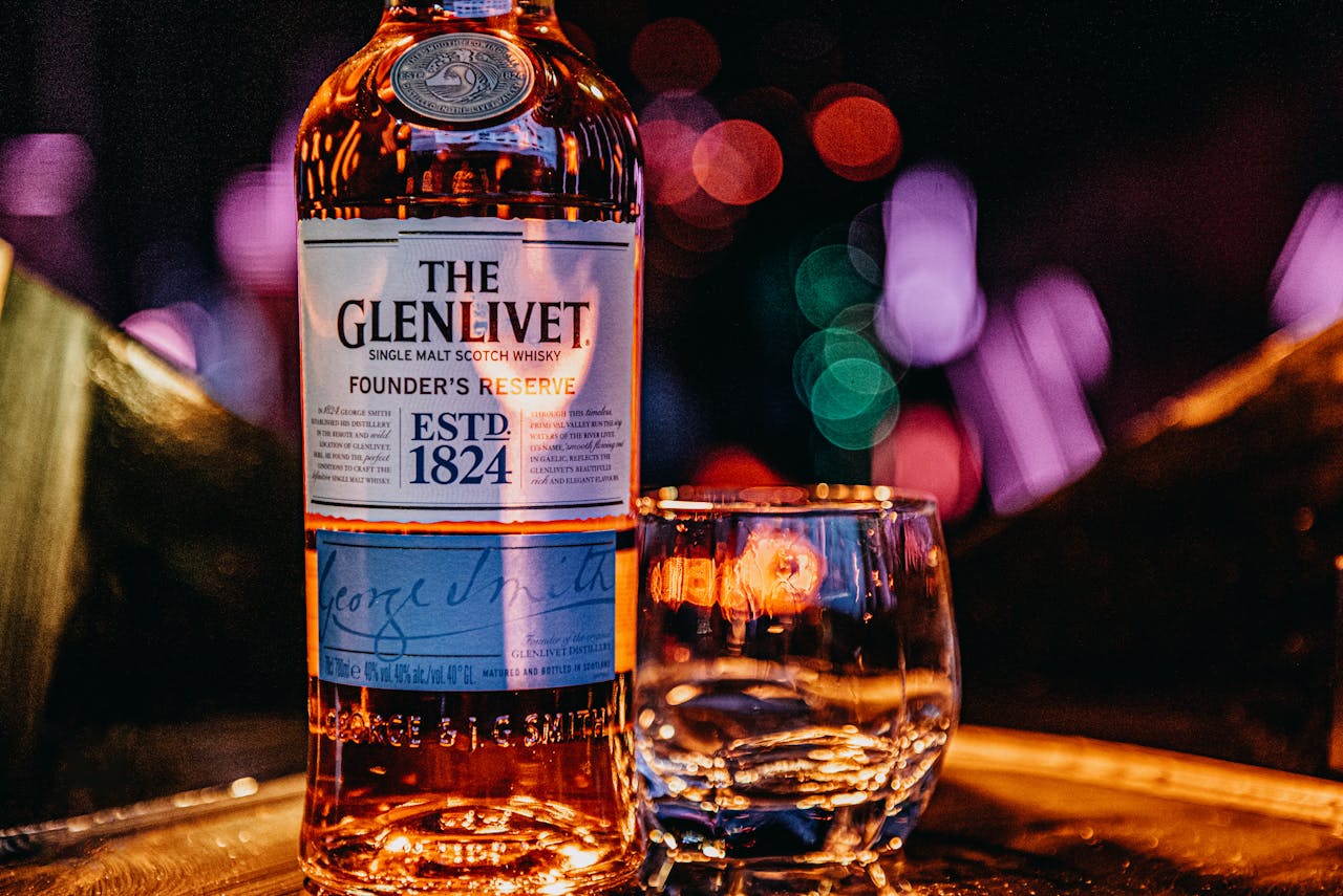 a bottle of whisky and a glass