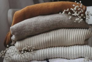 A pile of neatly folder jumpers
