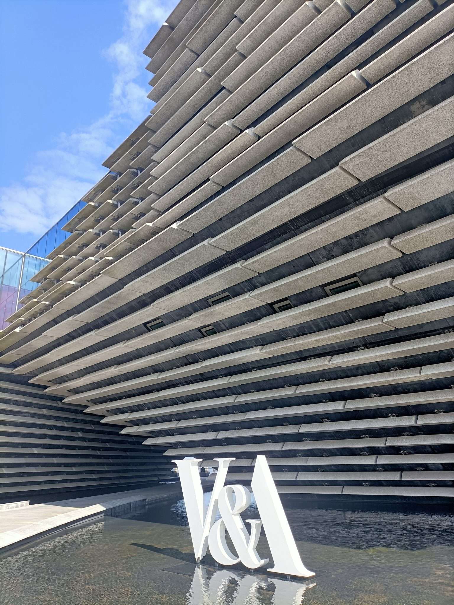 concrete building in a modern style with V&A lettering outside